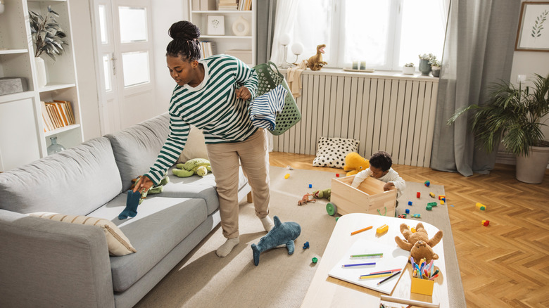 woman cleaning up living space
