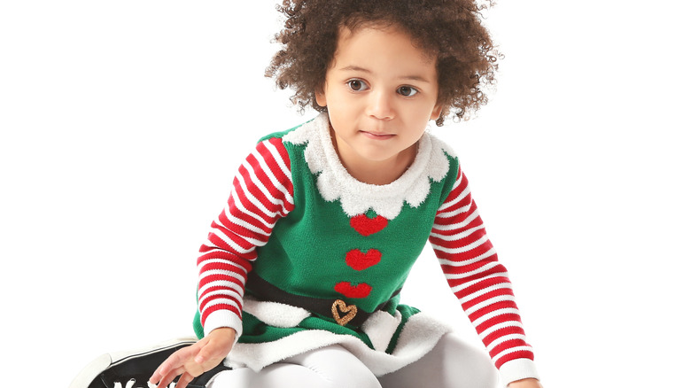 young girl dressed as an elf