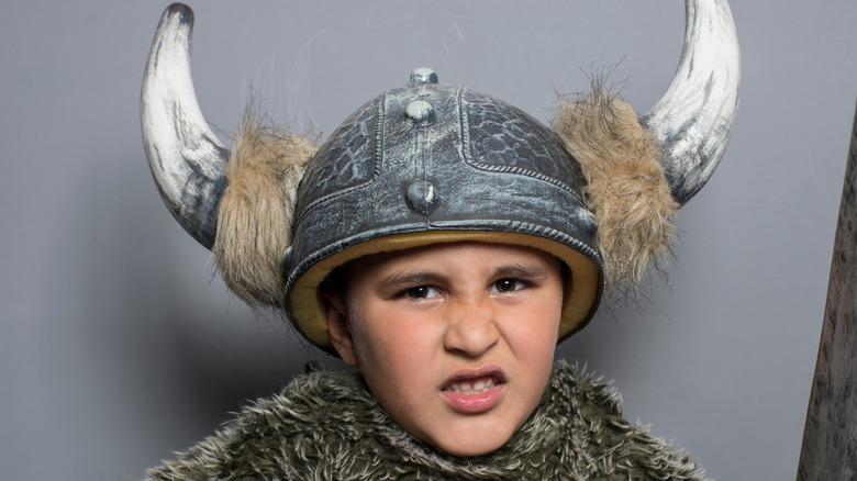 little boy or girl wearing viking hat