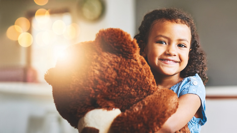 little girl with a giant stuffed bear