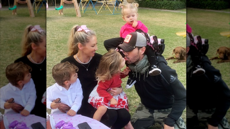 Anna Kournikova and Enrique Iglesias with their kids in the backyard