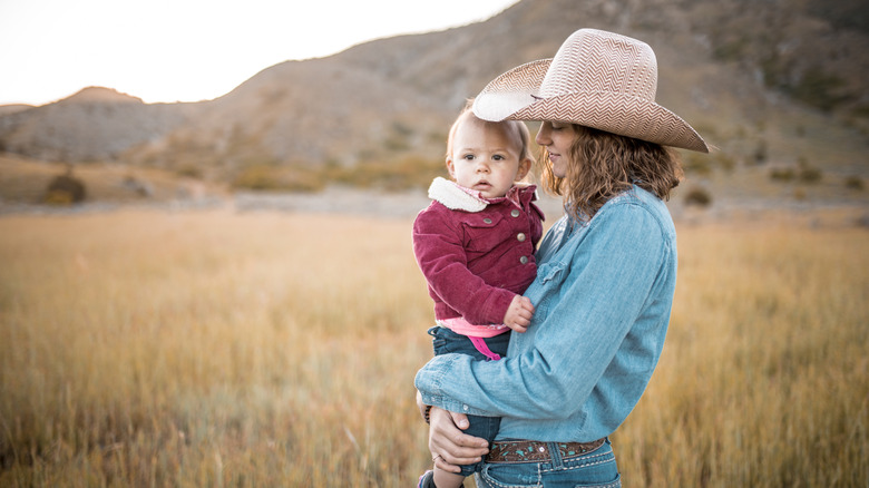 baby and mom on a ranch