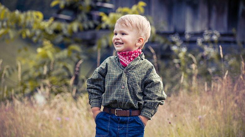 little boy wearing a bandana