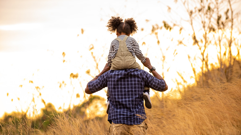 father and daughter on a walk outside