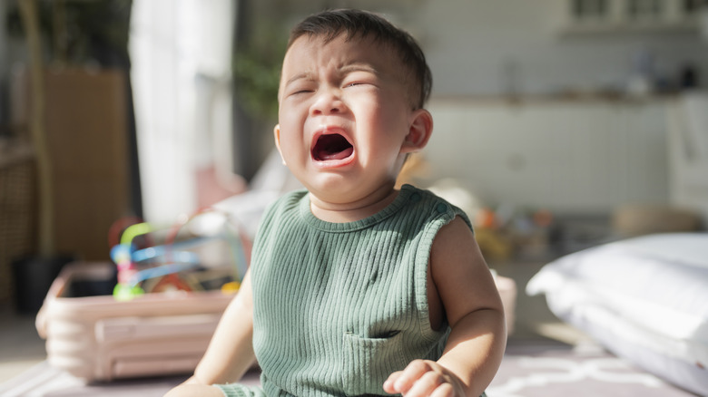 Toddler crying on the floor