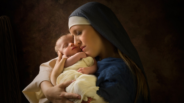 Mary holding a newborn baby