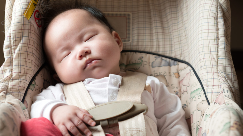 sleeping infant in a carseat