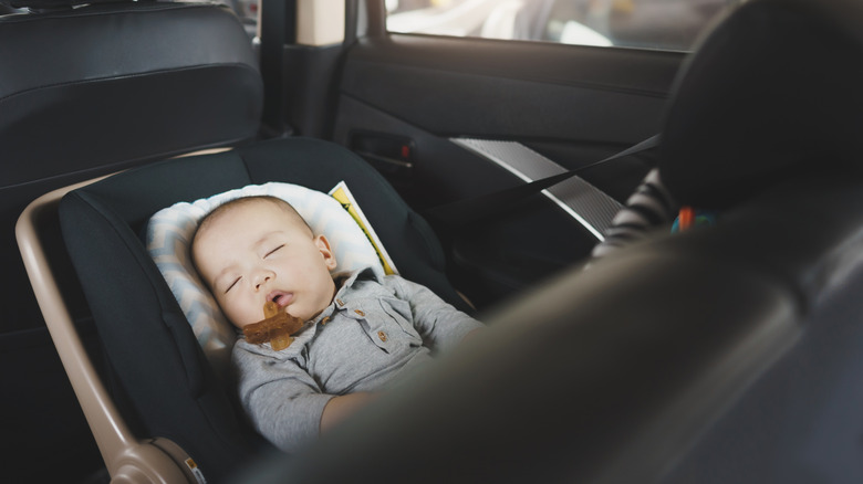 Baby sleeping in a rear-facing car seat