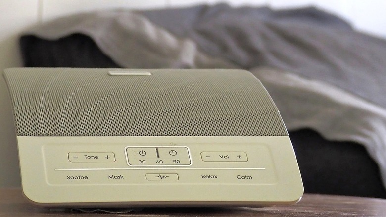 Close-up of a sound machine on a wooden surface