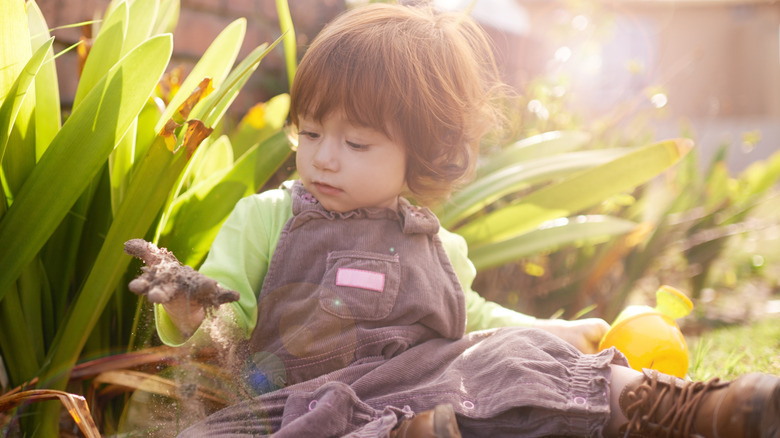little girl playing in the garden